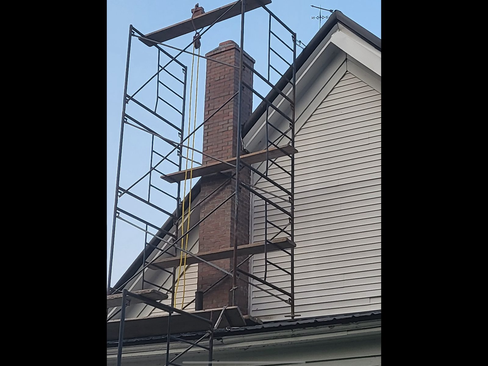 Chimney repair in progress with scaffolding