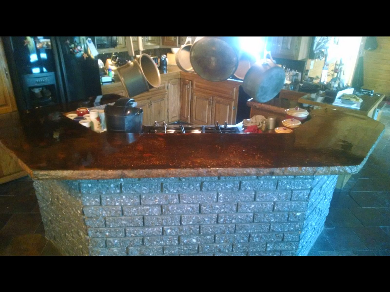 Custom masonry kitchen island with stone surround